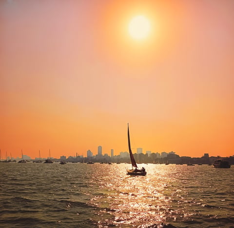 Sailboat at sunset with ocean view