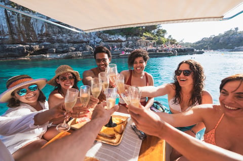 Tourists enjoying boat trip at sea