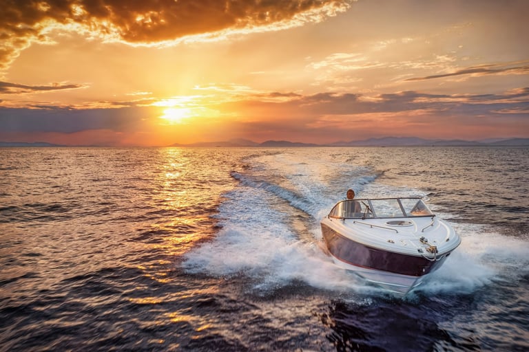 Speedboat cruising over the ocean during golden sunset
