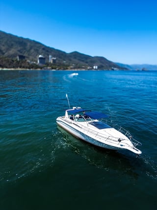 White speedboat moored